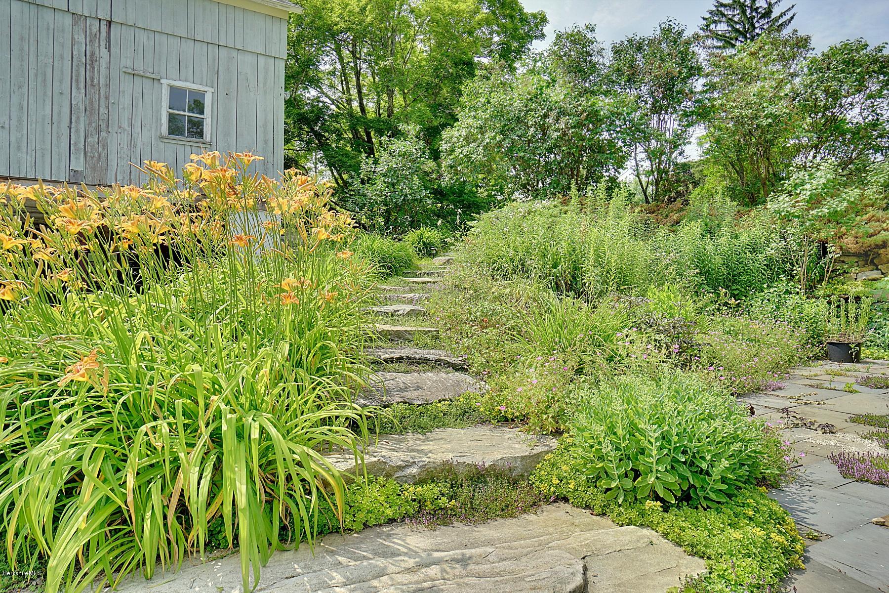 200 Main Road Monterey, MA 01245 - Photo 7 of 30 a backyard of a house with lots of green space