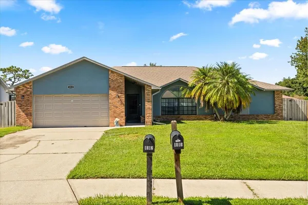 a house view with a garden space