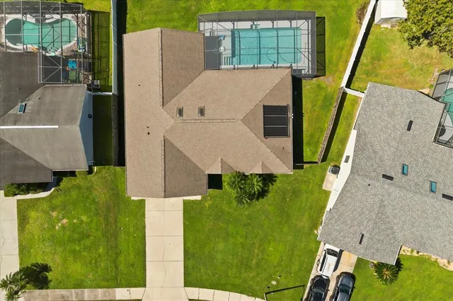 an aerial view of a house with swimming pool
