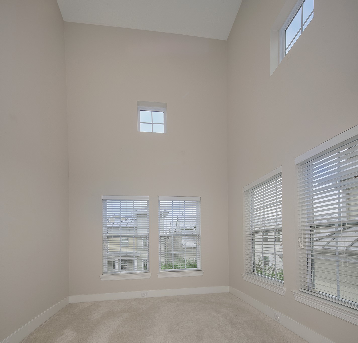 190 West Breezy Way Spring, TX 77380 - Photo 26 of 33 The soaring ceilings and multiple windows create bright & airy atmosphere.
