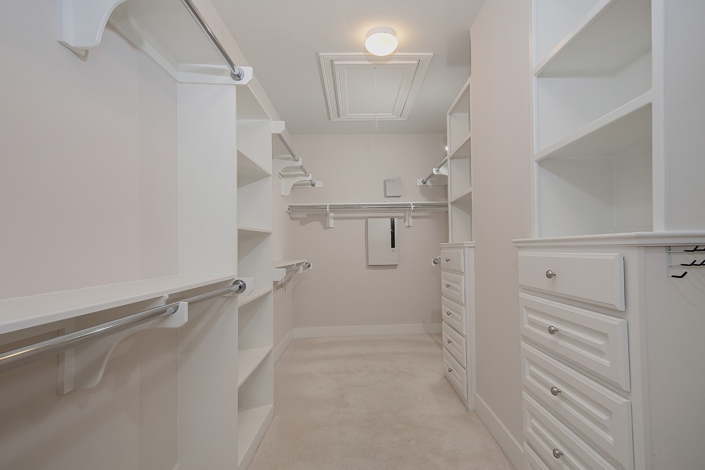 190 West Breezy Way Spring, TX 77380 - Photo 28 of 33 Spacious walk-in closet with ample shelving, built-in drawers, and multiple hanging rods. Ideal for organizing clothing and accessories.