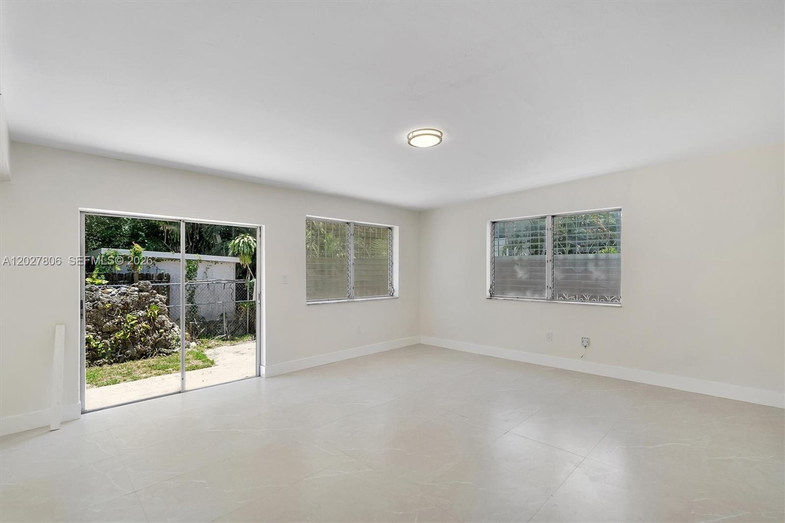 1612 Southwest 23rd Street, Unit 1612 Miami, FL 33145 - Photo 17 of 42 an empty room with windows