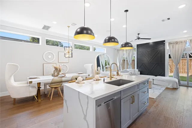 a kitchen with a sink stove and refrigerator