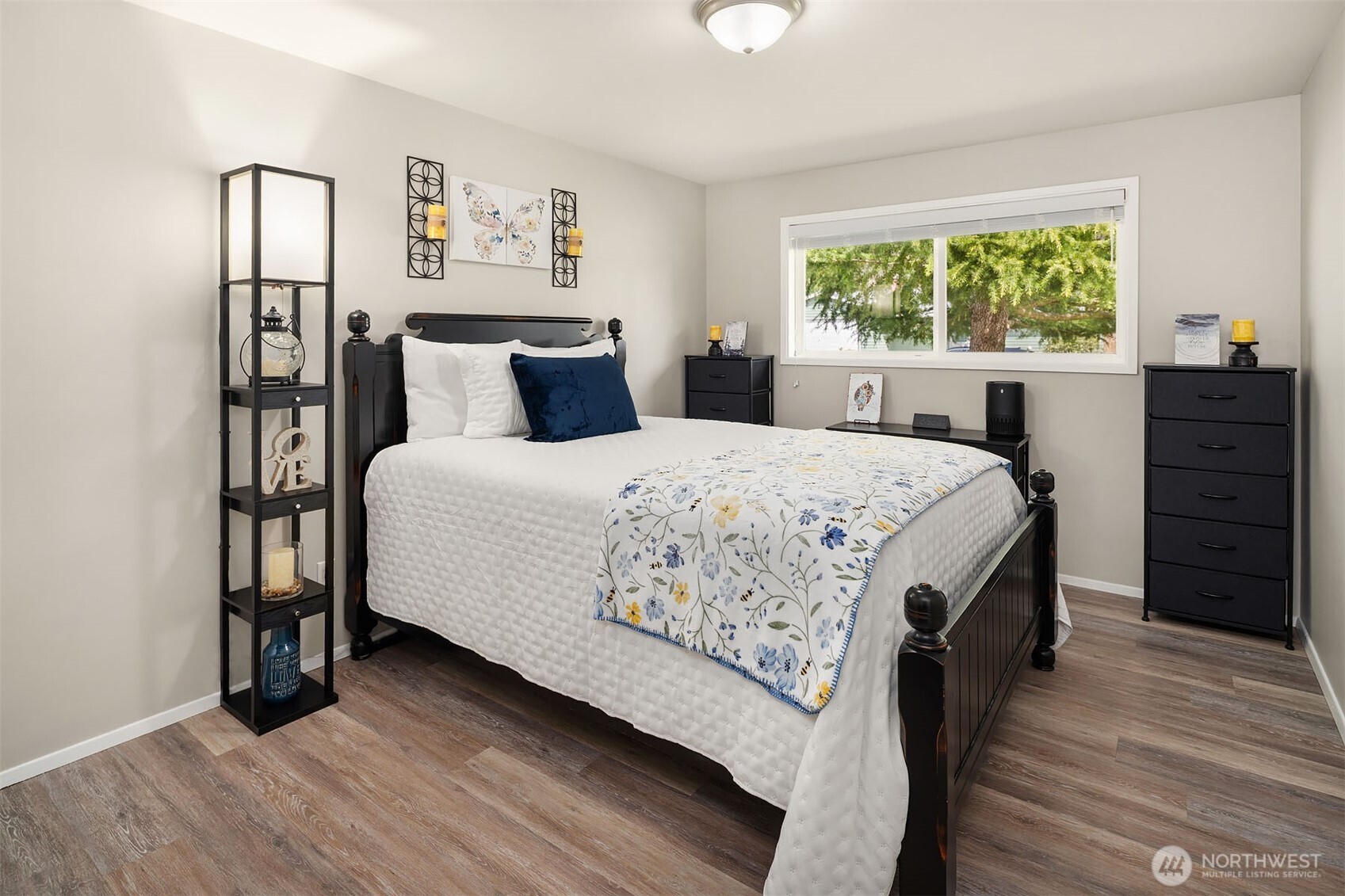 1067 Anacortes Avenue Northeast Renton, WA 98059 - Photo 16 of 34 a bedroom with a bed a dresser and a window