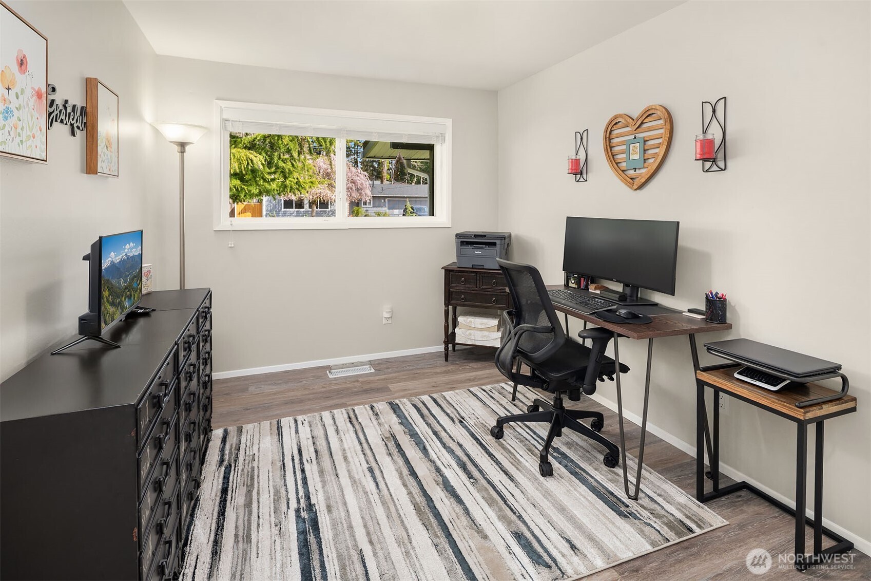 1067 Anacortes Avenue Northeast Renton, WA 98059 - Photo 18 of 34 a view of a workspace with furniture and a window