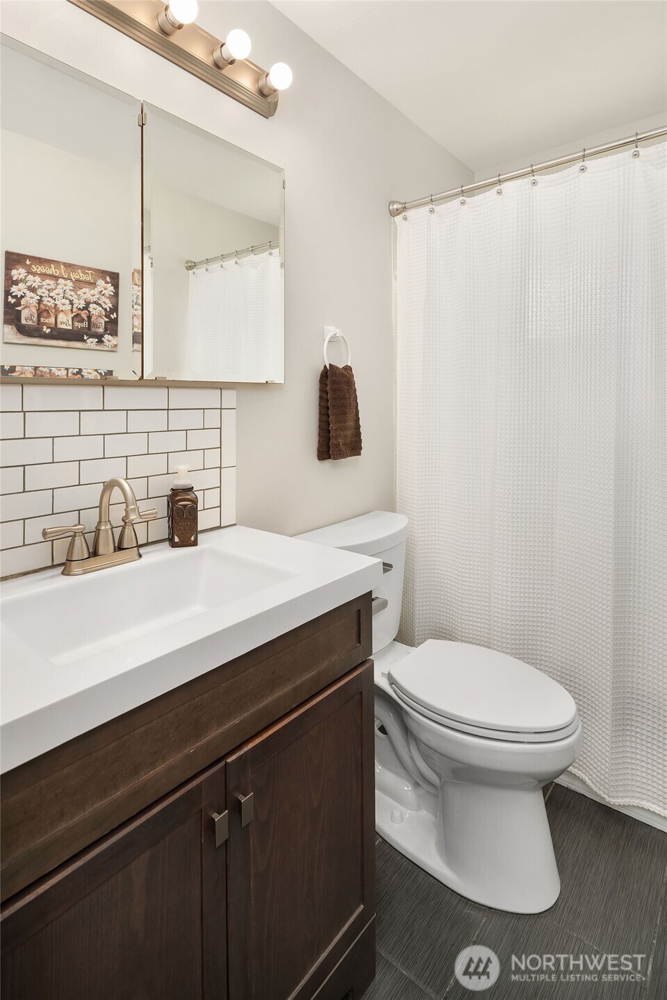 1067 Anacortes Avenue Northeast Renton, WA 98059 - Photo 19 of 34 a bathroom with a sink toilet and mirror