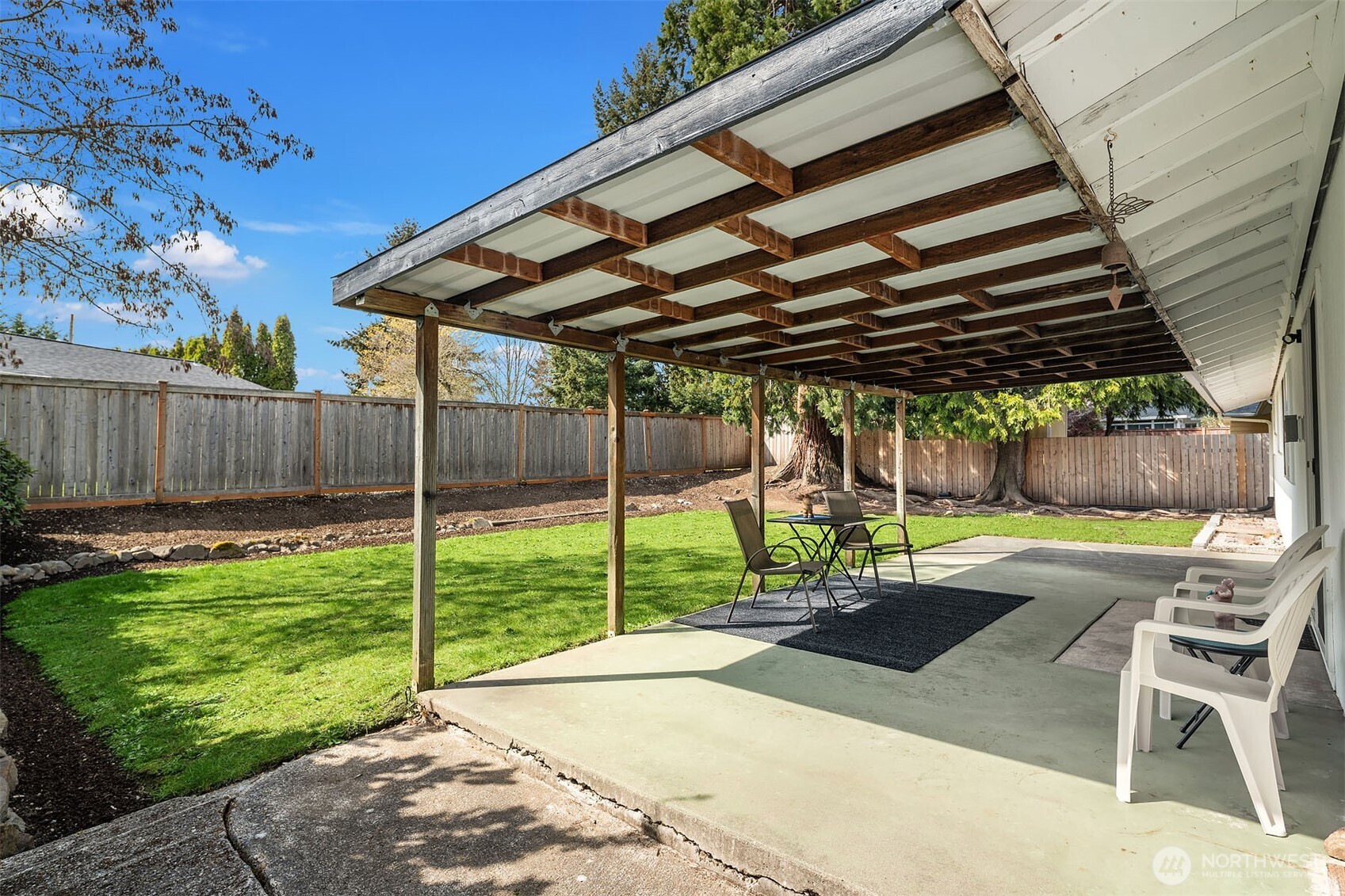 1067 Anacortes Avenue Northeast Renton, WA 98059 - Photo 22 of 34 a view of a backyard with a patio