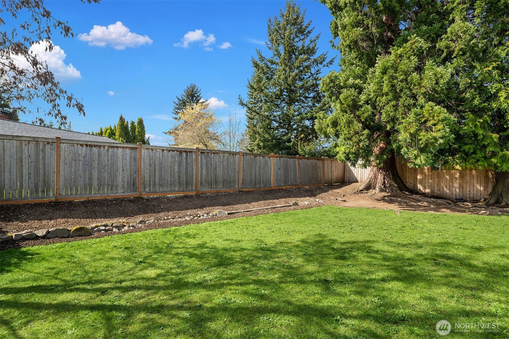 1067 Anacortes Avenue Northeast Renton, WA 98059 - Photo 25 of 34 a view of a backyard with a garden