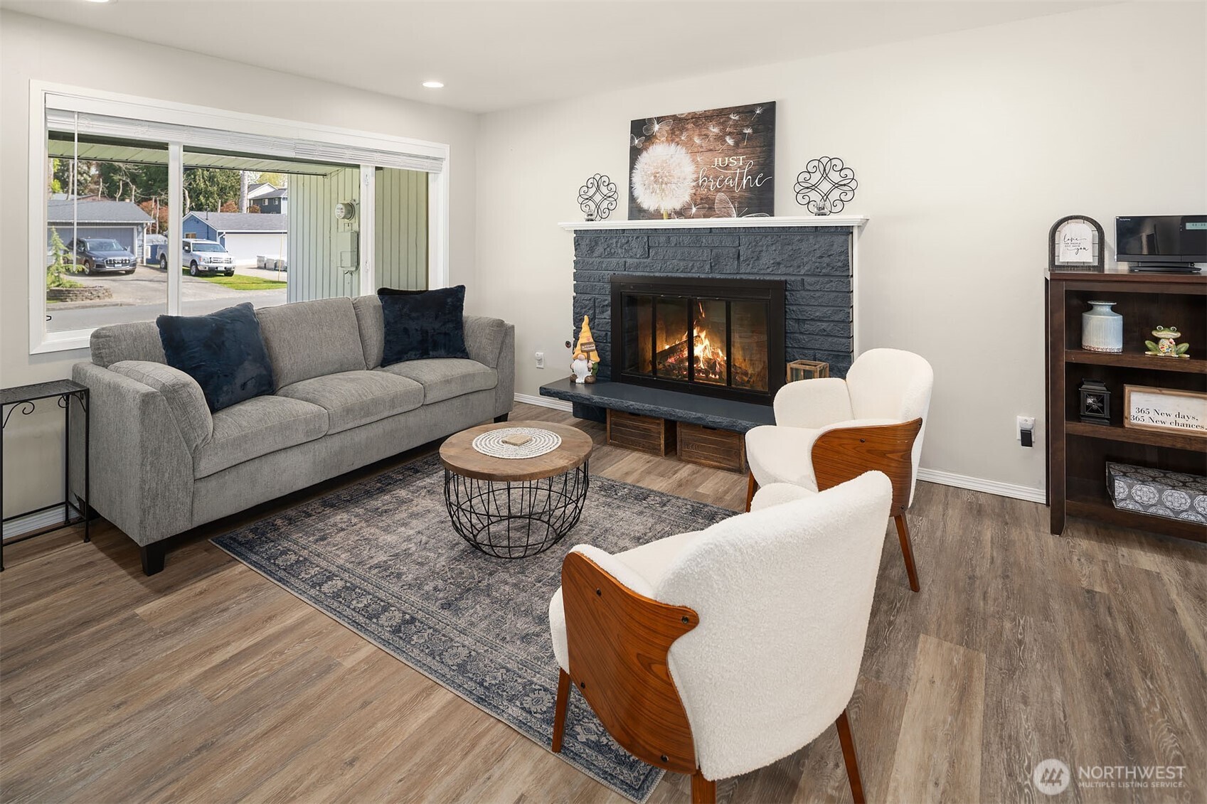 1067 Anacortes Avenue Northeast Renton, WA 98059 - Photo 5 of 34 a living room with furniture and a fireplace