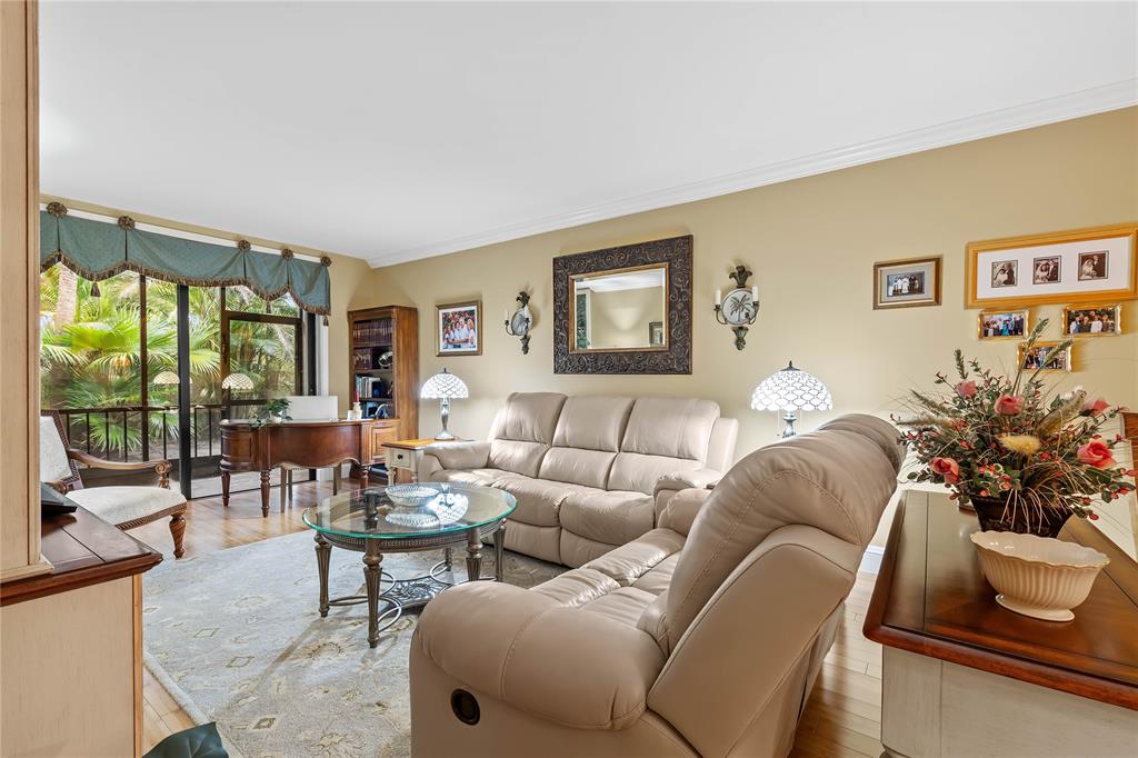 7970 La Mirada Drive, Unit 20 Boca Raton, FL 33433 - Photo 13 of 38 a living room with furniture and a large window