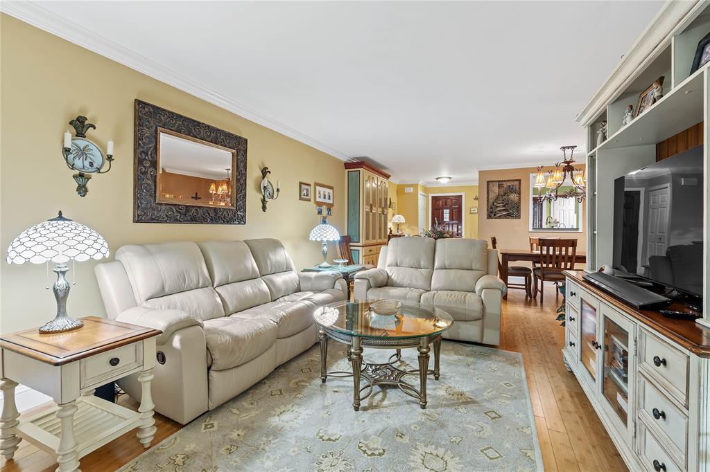 7970 La Mirada Drive, Unit 20 Boca Raton, FL 33433 - Photo 14 of 38 a living room with furniture and a flat screen tv