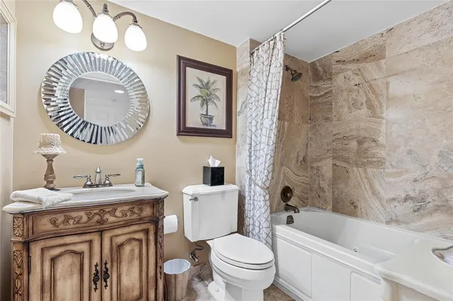 a bathroom with a sink a toilet and a bathtub