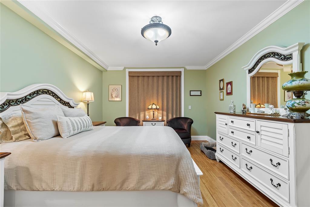 7970 La Mirada Drive, Unit 20 Boca Raton, FL 33433 - Photo 20 of 38 a bedroom with a bed and a dresser