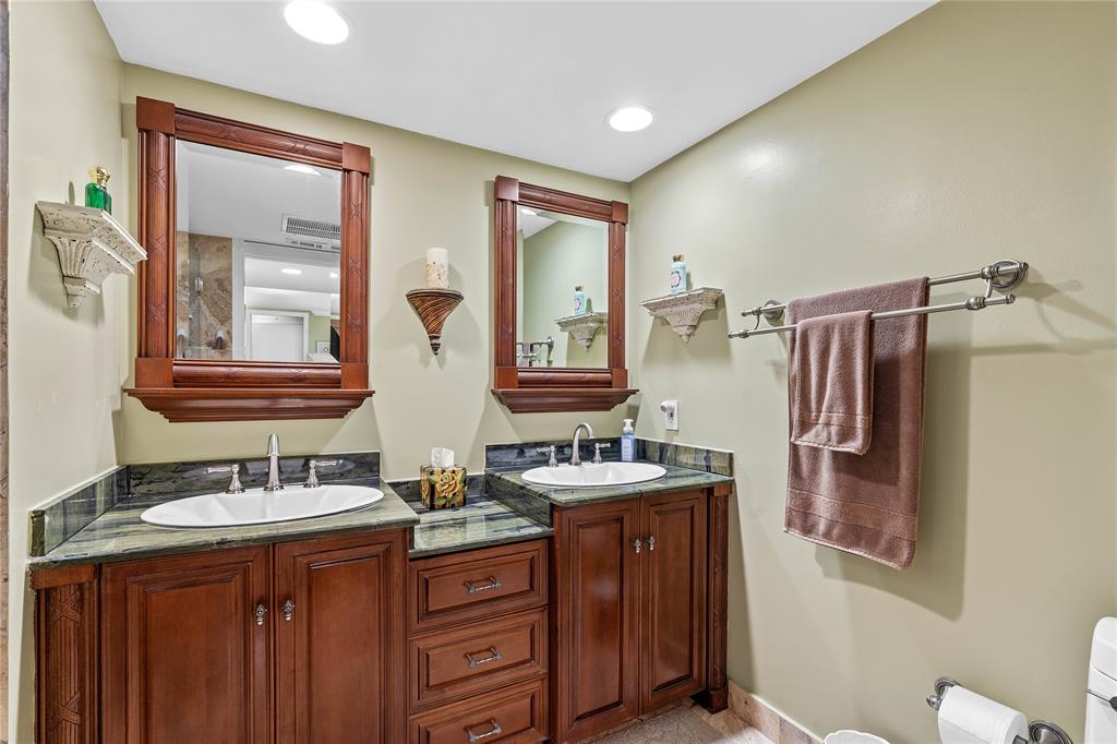 7970 La Mirada Drive, Unit 20 Boca Raton, FL 33433 - Photo 24 of 38 a bathroom with 2 sink and a mirror