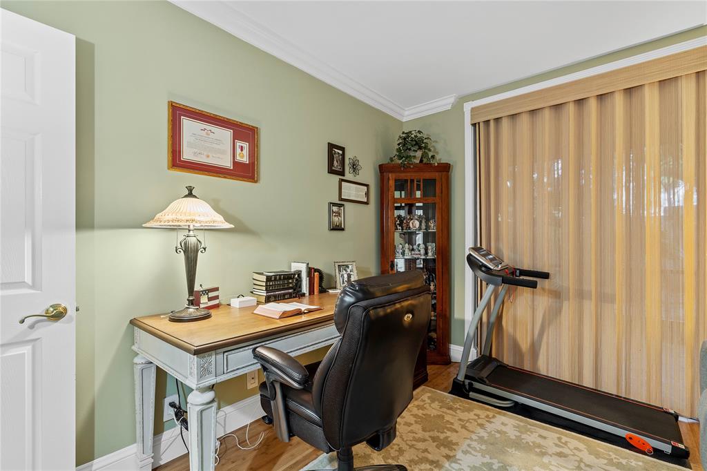 7970 La Mirada Drive, Unit 20 Boca Raton, FL 33433 - Photo 29 of 38 a room with a table chairs and a window