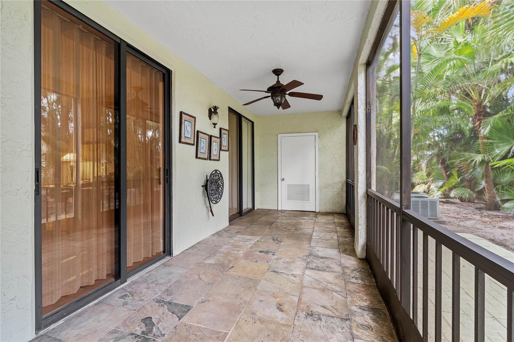 7970 La Mirada Drive, Unit 20 Boca Raton, FL 33433 - Photo 32 of 38 a view of a porch with wooden floor and stairs