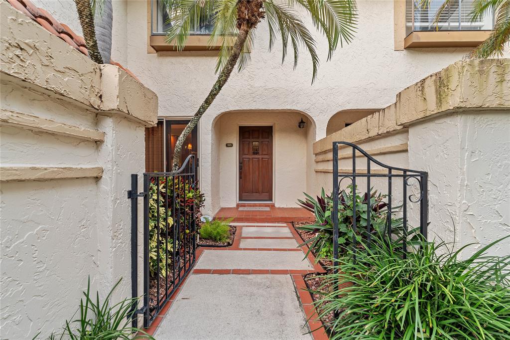 7970 La Mirada Drive, Unit 20 Boca Raton, FL 33433 - Photo 4 of 38 a front view of a house with a garden