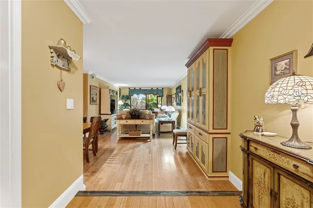 a view of living room with furniture and wooden floor