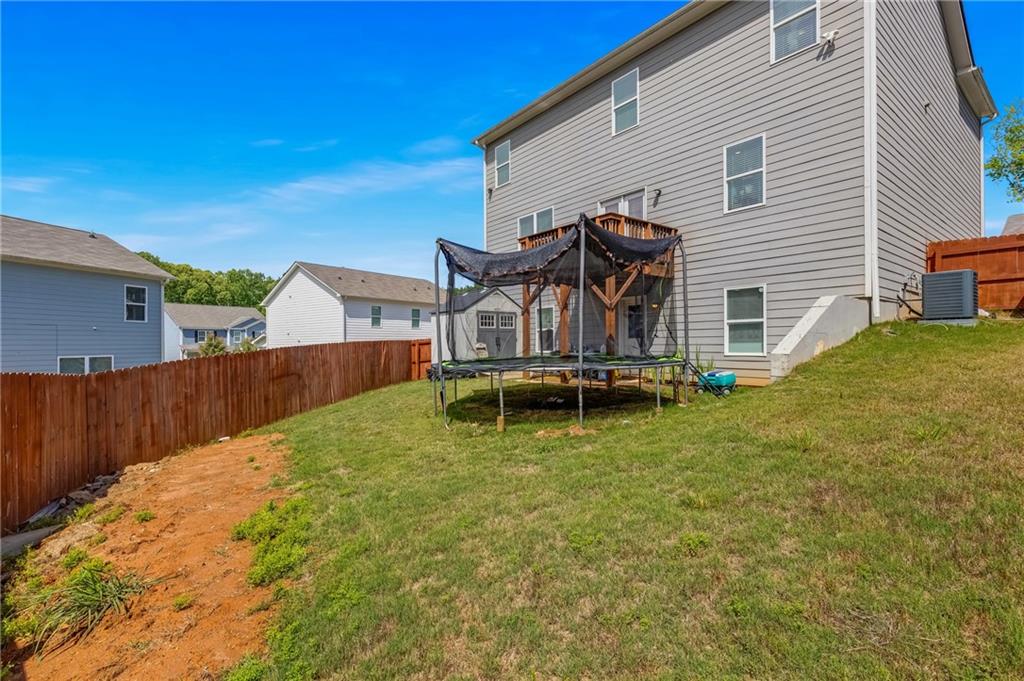 575 Walnut Grv Way Pendergrass, GA 30567 - Photo 37 of 39 a view of a house with wooden fence