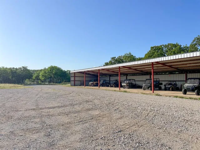 a view of a car park in front of house