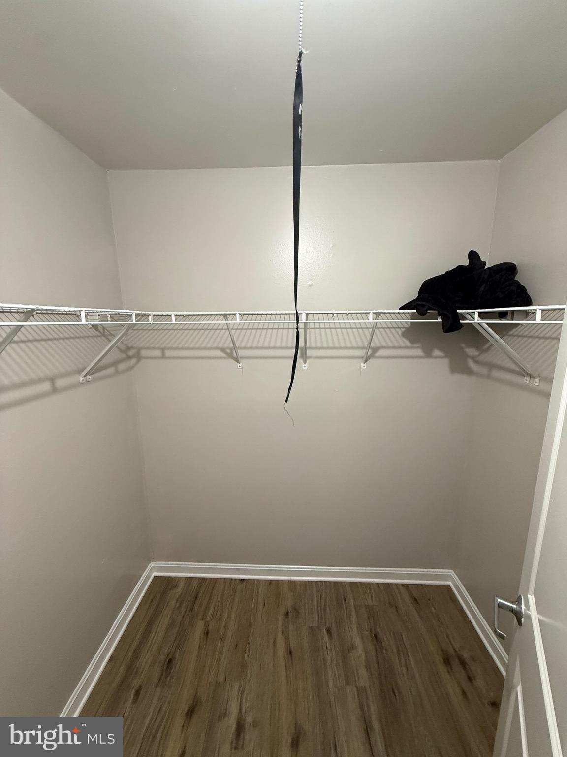 3105 Naylor Road Southeast, Unit 104 Washington, DC 20020 - Photo 5 of 12 a view of a room with racks on the wall