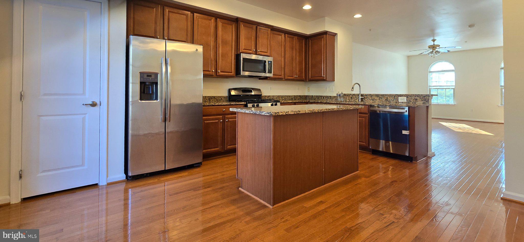 7339 Old Calvary Road Hanover, MD 21076 - Photo 6 of 22 Modern kitchen with warm wood accents.