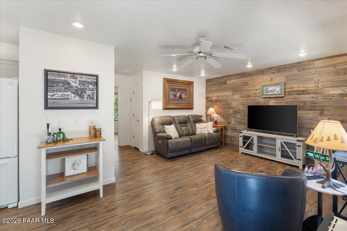 1388 East Pine Ridge Drive Prescott, AZ 86303 - Photo 5 of 16 a living room with furniture and a flat screen tv