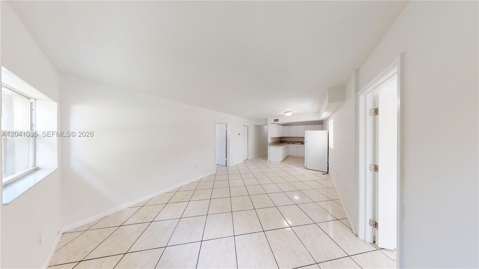 6811 Southwest 16th Street Miami, FL 33144 - Photo 1 of 21 a view of an empty room and window