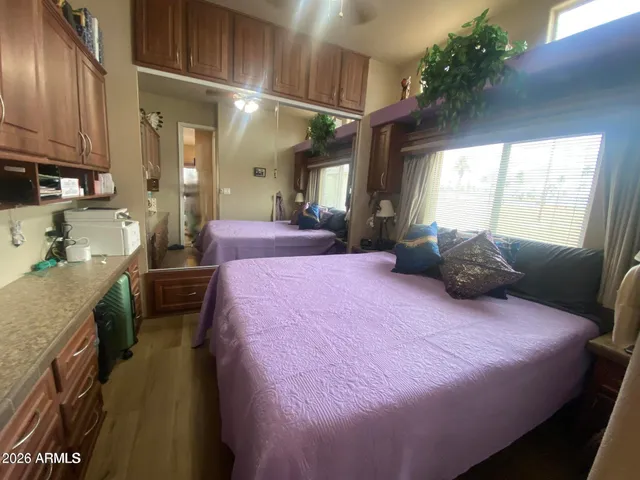 a kitchen view with granite countertop a refrigerator stove and sink