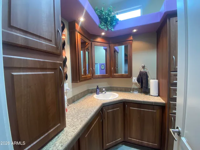 a bathroom with a toilet and a mirror