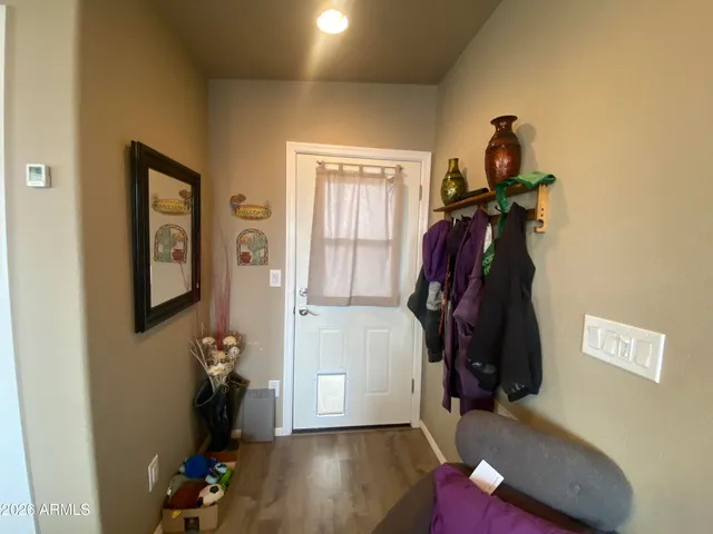 a backyard of a house with table and chairs
