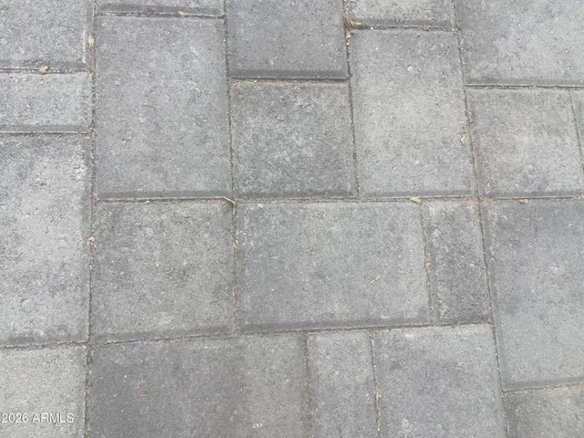 a balcony with table and chairs