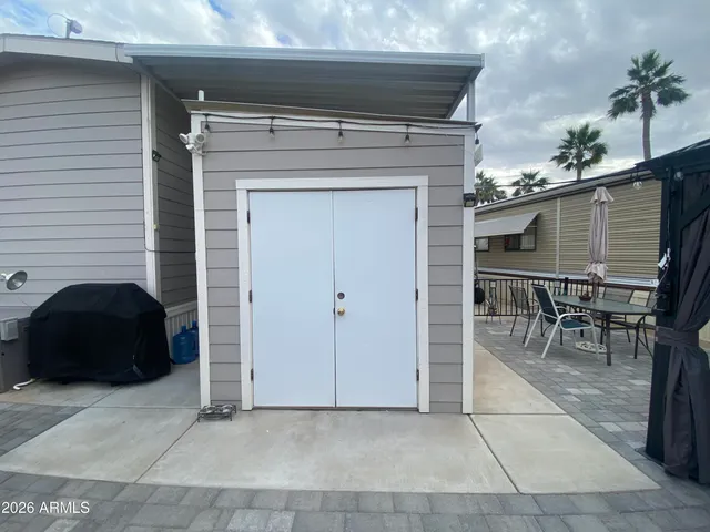 a outdoor space with patio couch and a potted plant