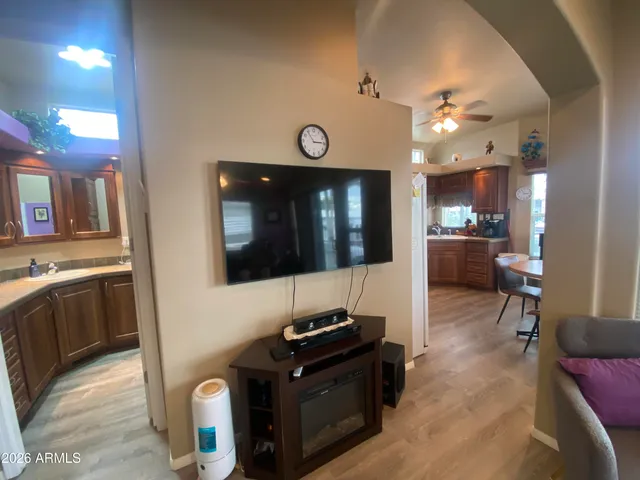 a view of kitchen with kitchen island stainless steel appliances sink stove and microwave
