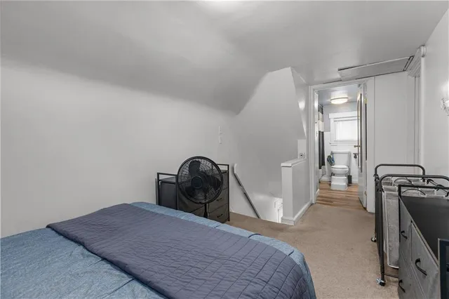 a bedroom with a bed and gym equipment