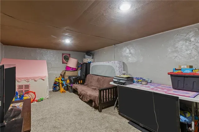 a bedroom with furniture and a bed