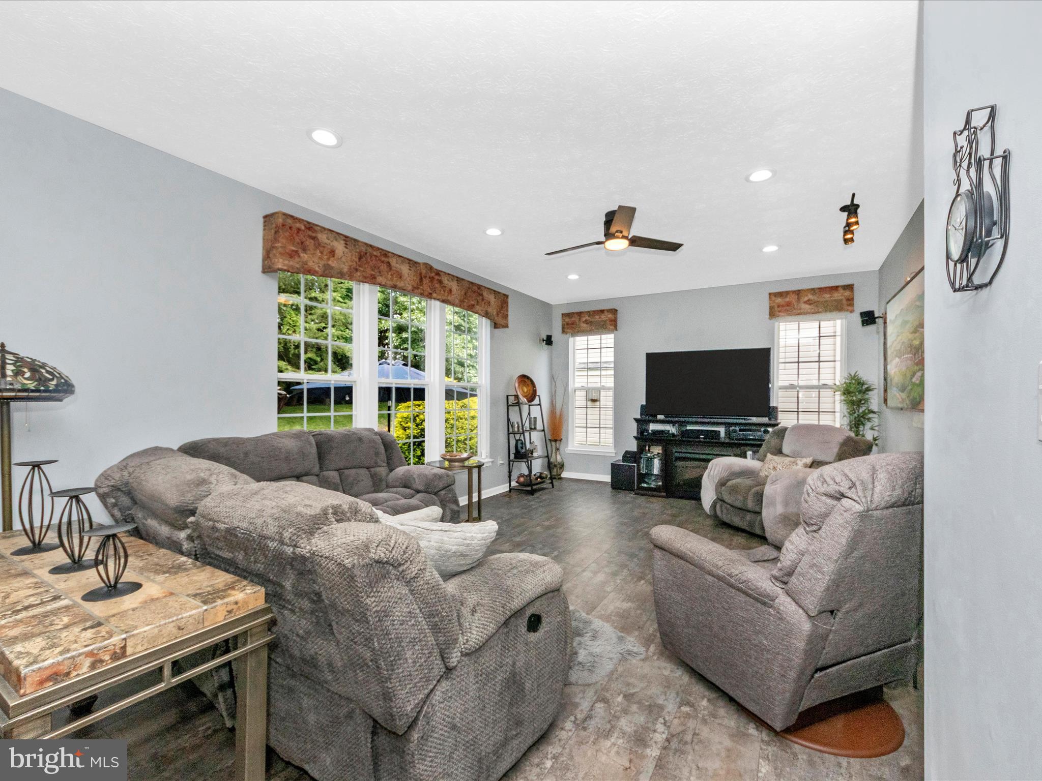 7732 Rotherham Drive Hanover, MD 21076 - Photo 11 of 55 a living room with furniture and a flat screen tv