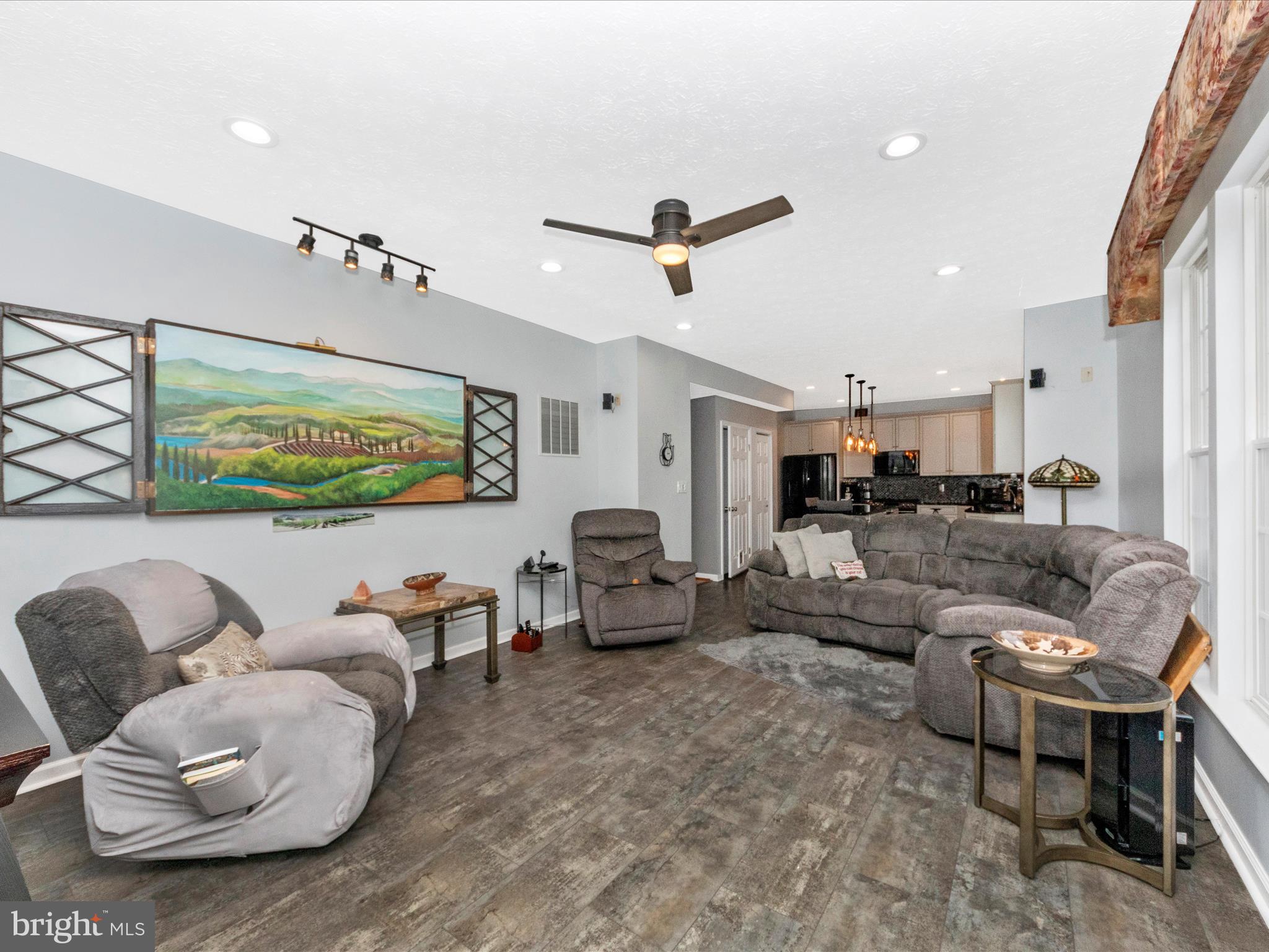 7732 Rotherham Drive Hanover, MD 21076 - Photo 13 of 55 a living room with furniture and a large window