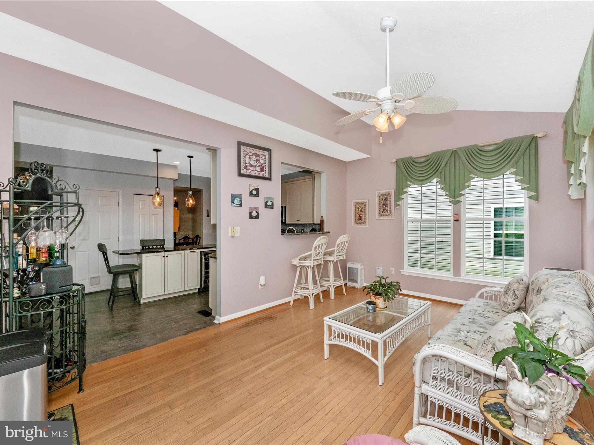 7732 Rotherham Drive Hanover, MD 21076 - Photo 17 of 55 a living room with furniture a flat screen tv and a large window
