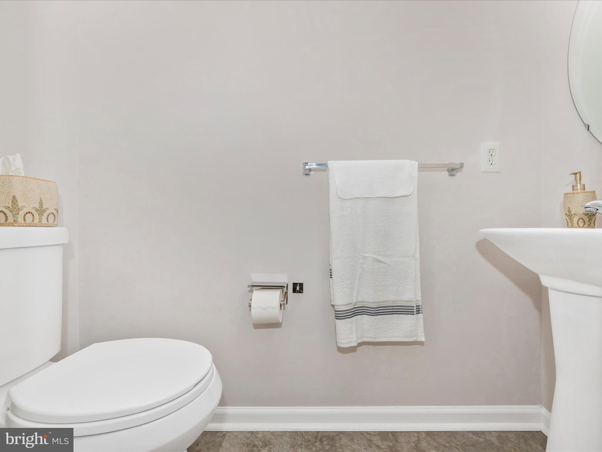 7732 Rotherham Drive Hanover, MD 21076 - Photo 18 of 55 a white toilet sitting next to a bathroom sink