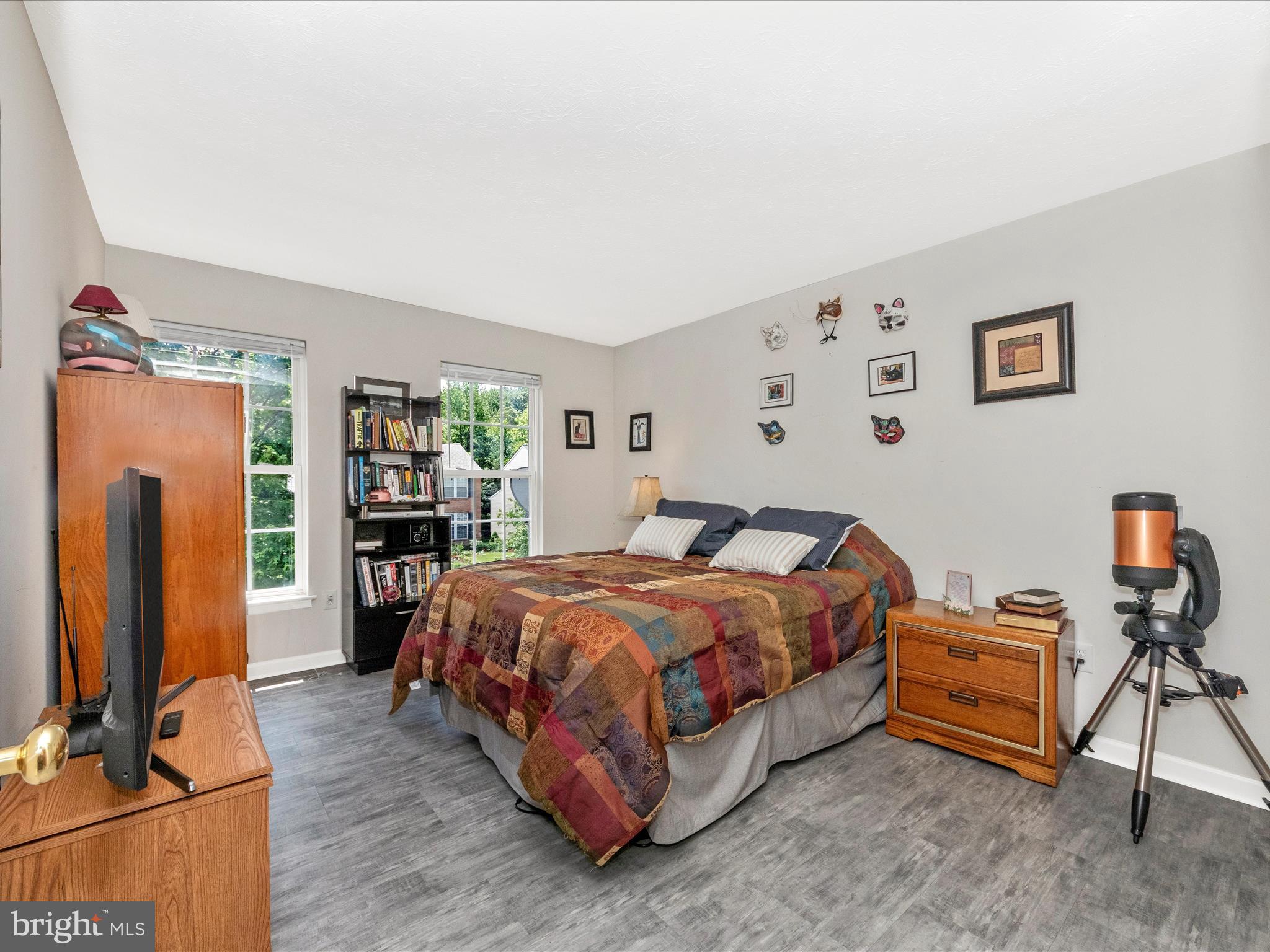 7732 Rotherham Drive Hanover, MD 21076 - Photo 28 of 55 a bedroom with a bed and a flat screen tv