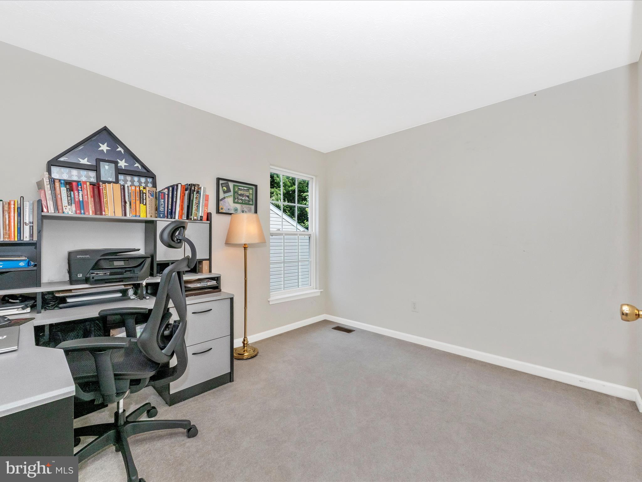 7732 Rotherham Drive Hanover, MD 21076 - Photo 30 of 55 a view of a workspace with furniture and a window