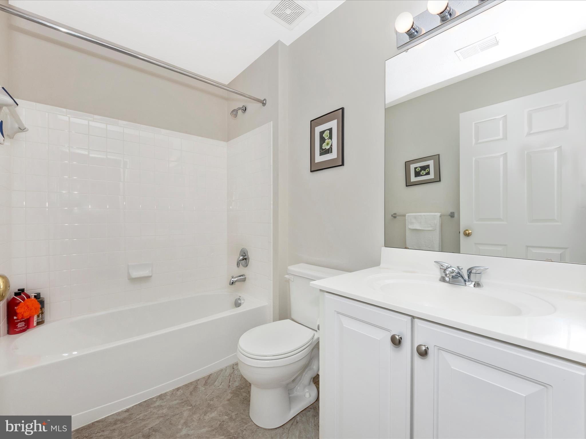 7732 Rotherham Drive Hanover, MD 21076 - Photo 32 of 55 a bathroom with a sink a toilet and shower