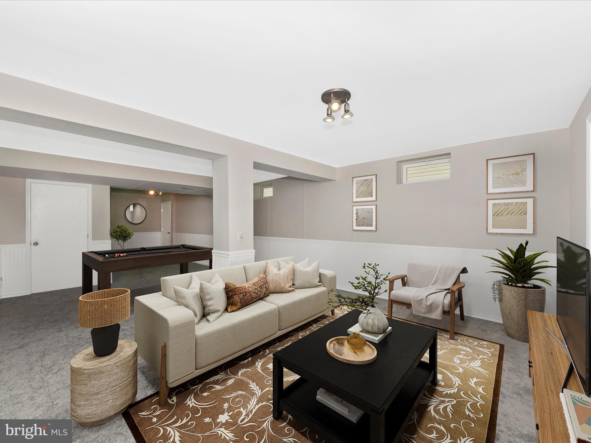 7732 Rotherham Drive Hanover, MD 21076 - Photo 37 of 55 a living room with furniture and wooden floor