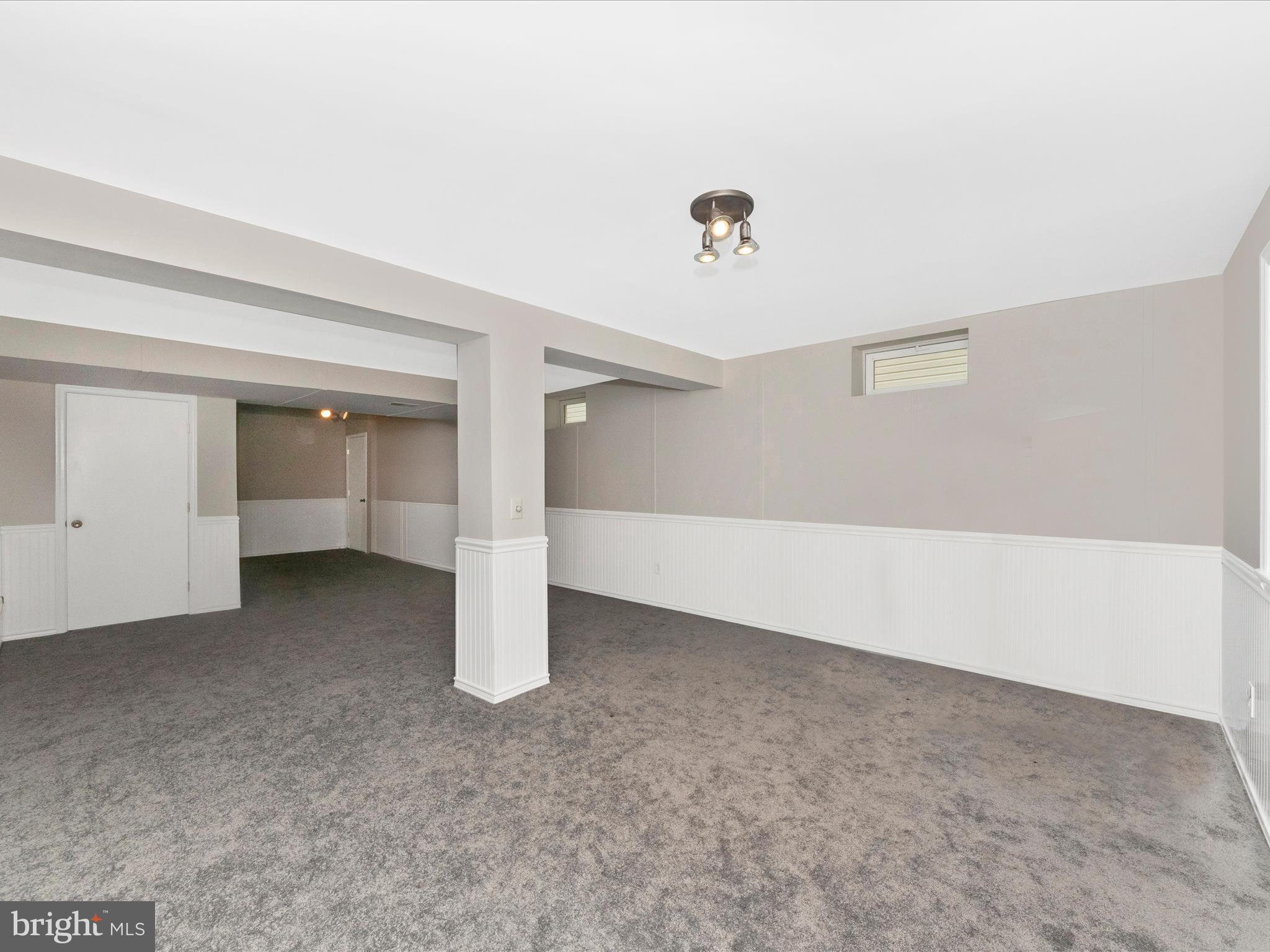 7732 Rotherham Drive Hanover, MD 21076 - Photo 38 of 55 an empty room with a empty space and windows