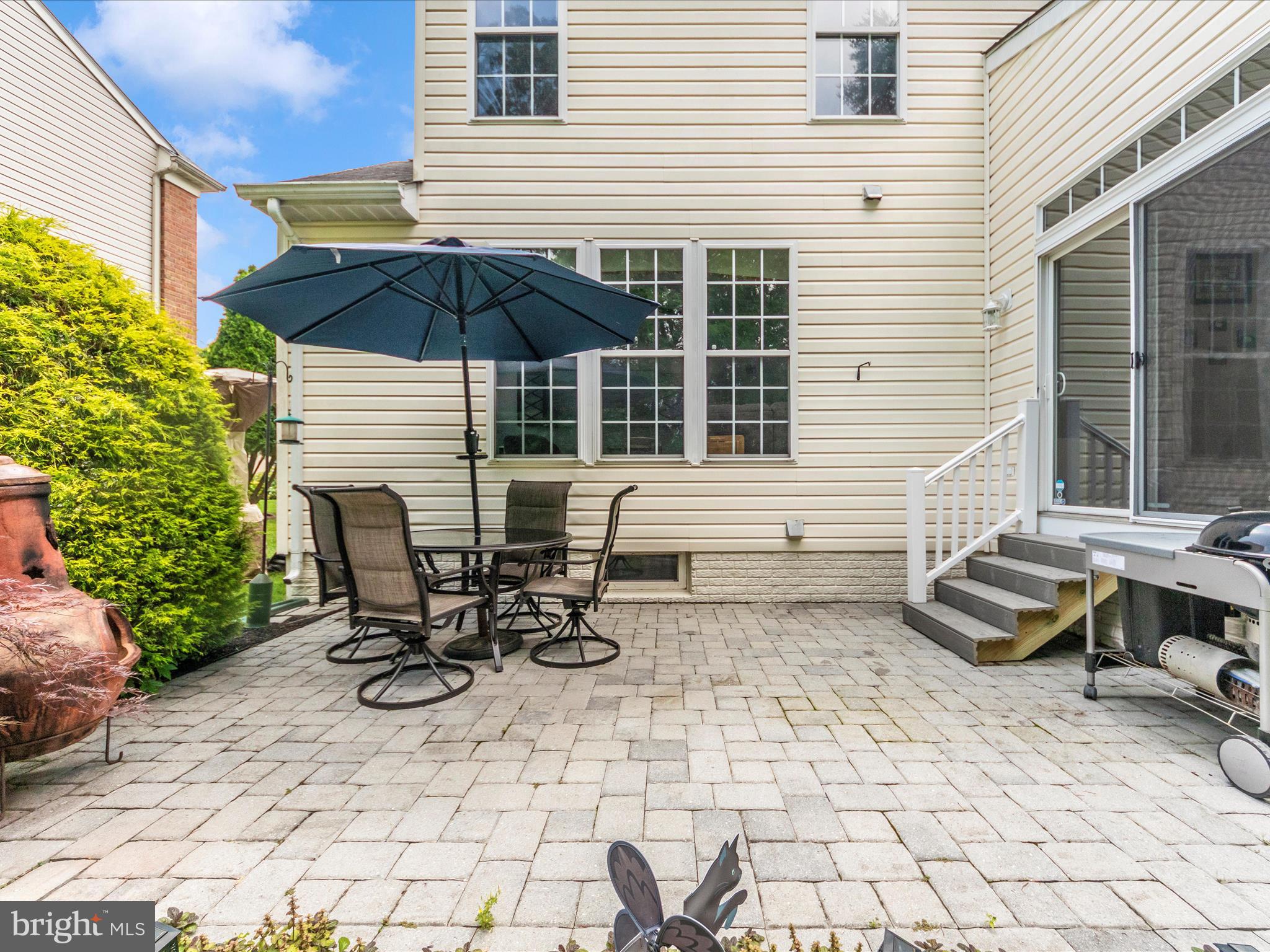 7732 Rotherham Drive Hanover, MD 21076 - Photo 46 of 55 a backyard of a house with table and chairs
