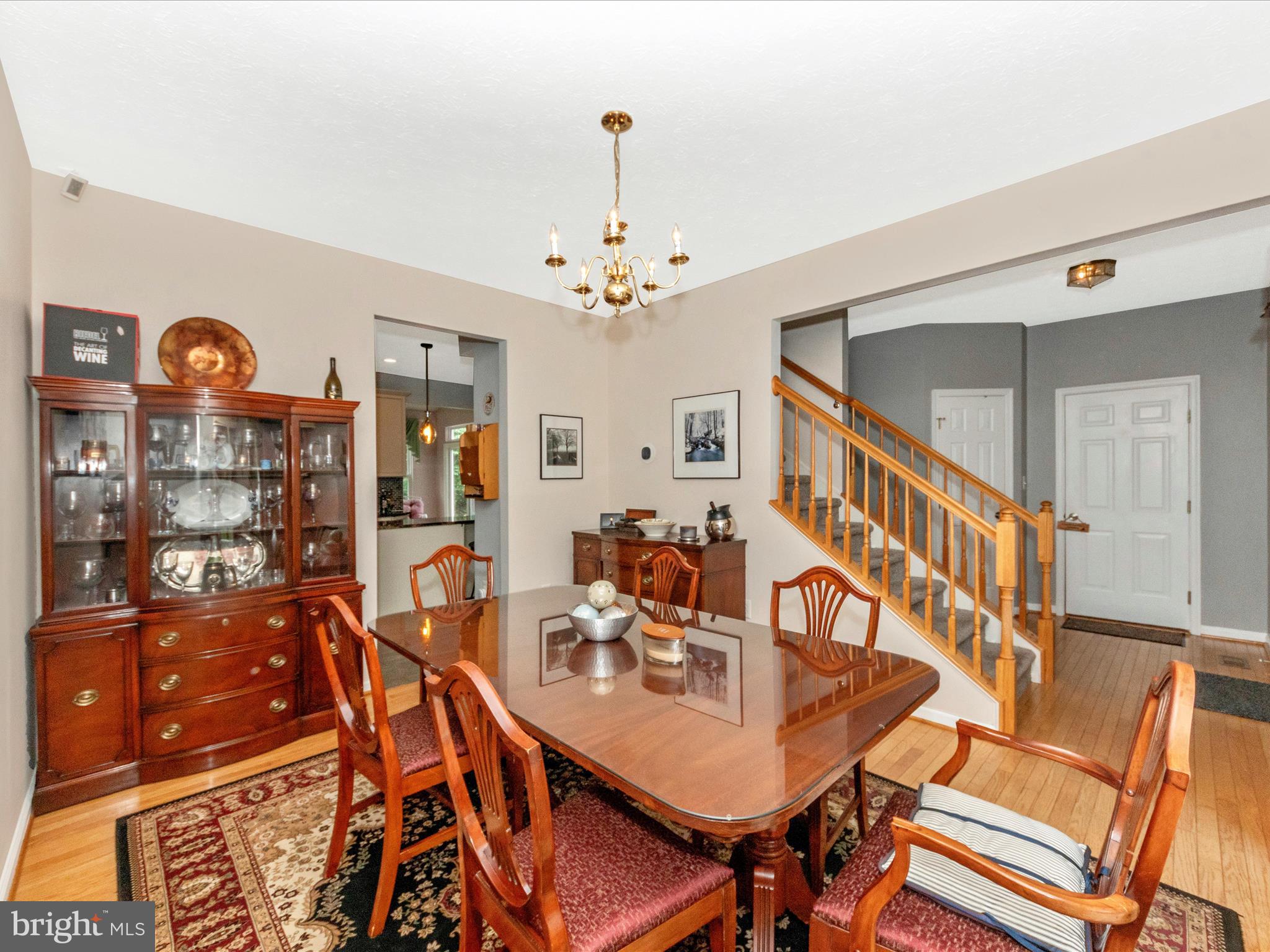 7732 Rotherham Drive Hanover, MD 21076 - Photo 9 of 55 a view of a dining room with furniture and a chandelier