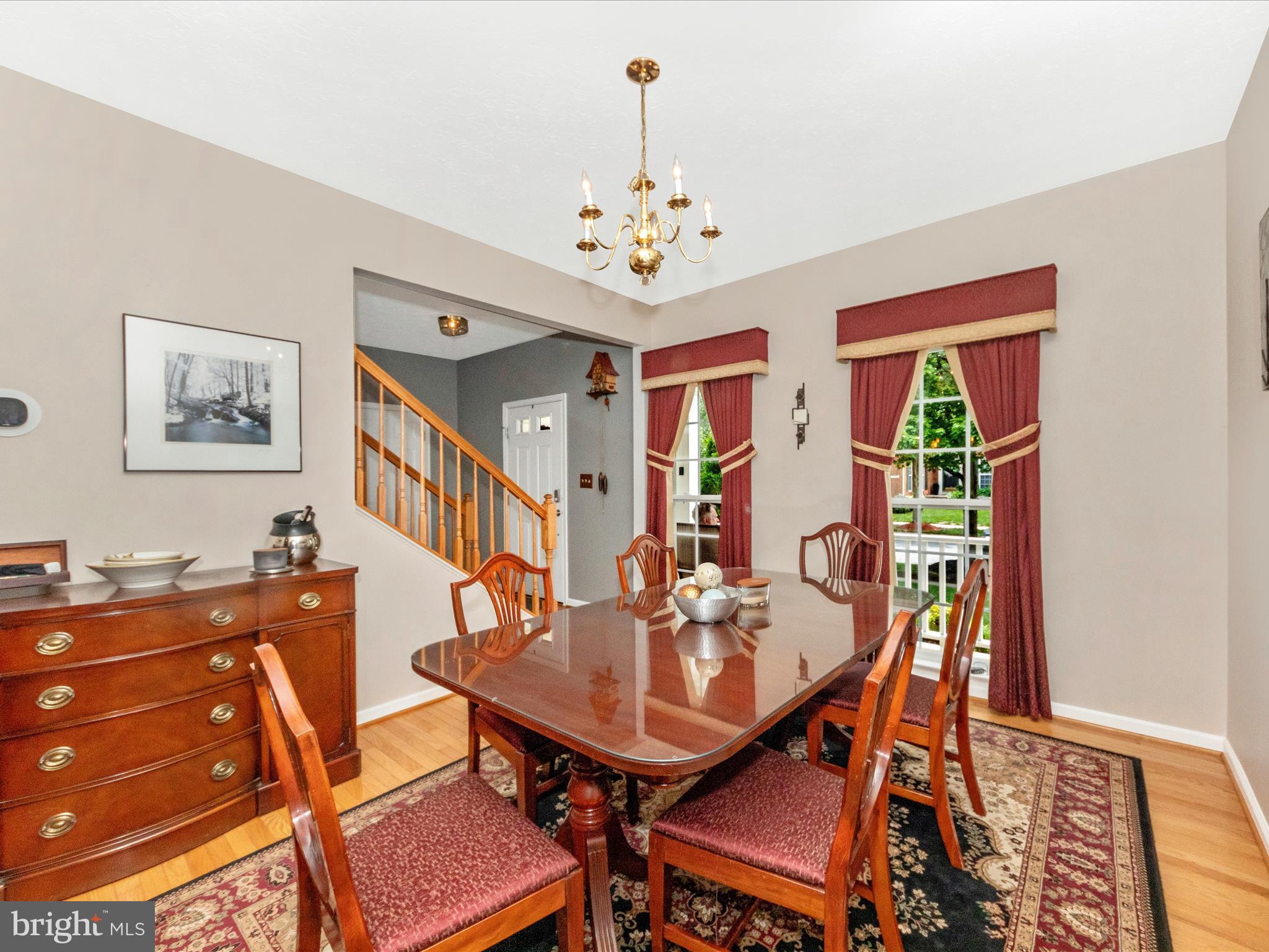 7732 Rotherham Drive Hanover, MD 21076 - Photo 10 of 55 a view of a dining room with furniture and chandelier