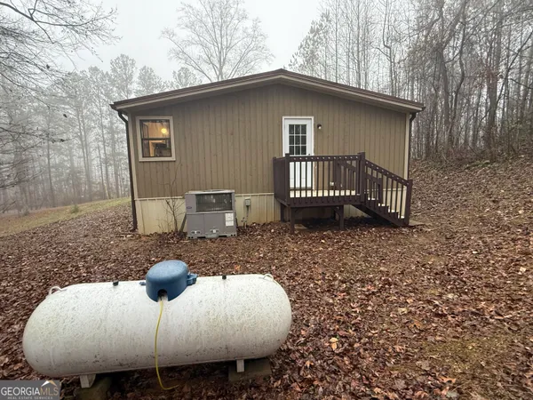 a view of a roof deck with table and chairs