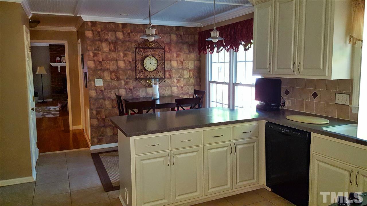 1113 Hamilton Way Durham, NC 27713 - Photo 11 of 25 a kitchen with stainless steel appliances granite countertop a refrigerator and a sink